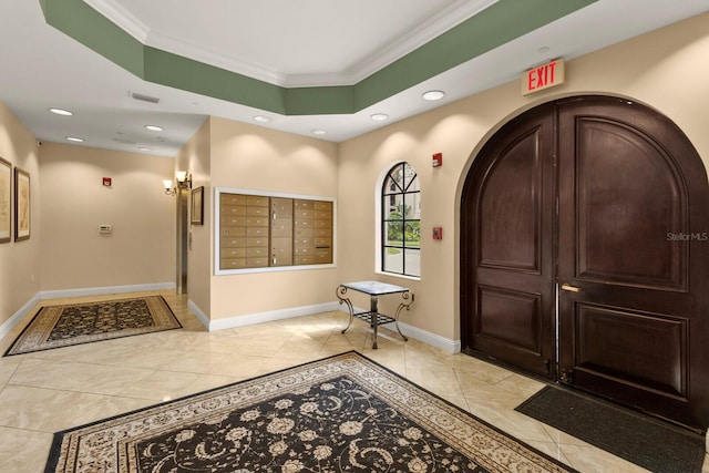 interior space with mail area, recessed lighting, baseboards, and ornamental molding