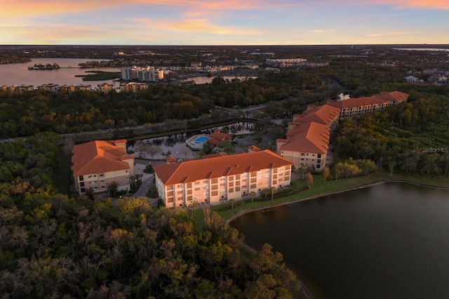 aerial view at dusk with a water view