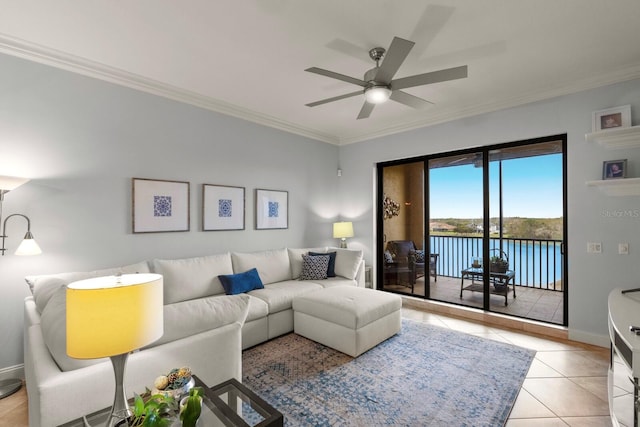 living area with light tile patterned floors, baseboards, ornamental molding, and a ceiling fan