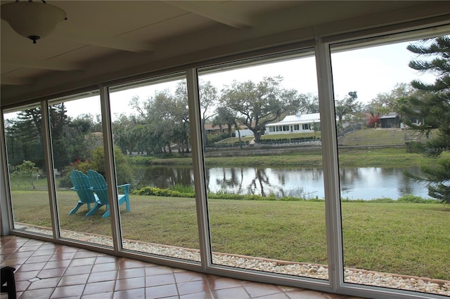 interior space featuring a water view and tile patterned floors