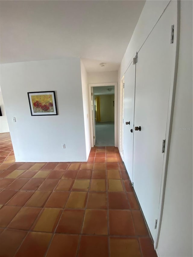 hallway featuring tile patterned floors