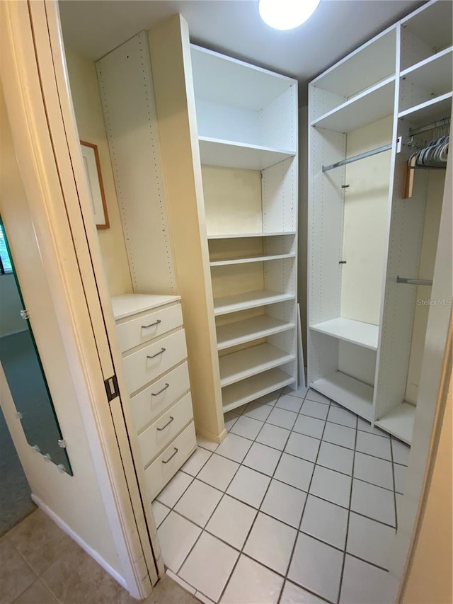 walk in closet featuring light tile patterned floors