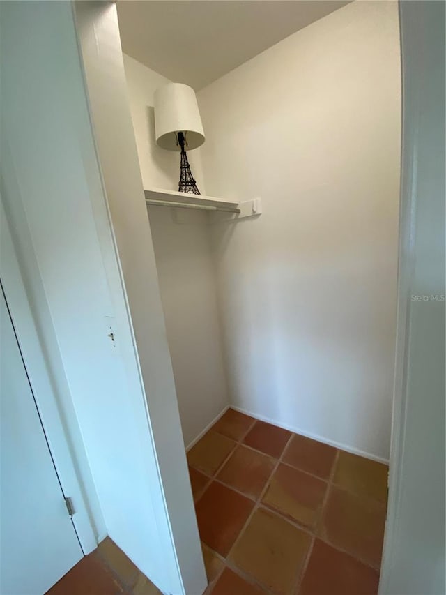 spacious closet featuring tile patterned floors