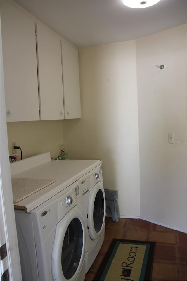 laundry room with cabinet space and washer and clothes dryer