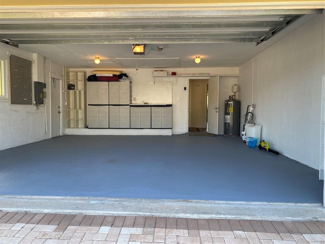 garage featuring electric panel, a garage door opener, and electric water heater