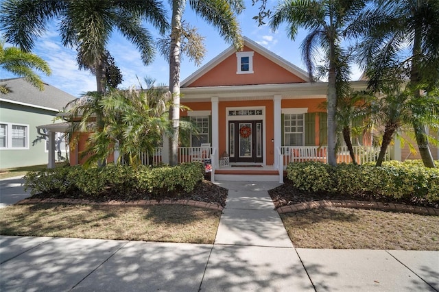 view of front of property with covered porch and stucco siding