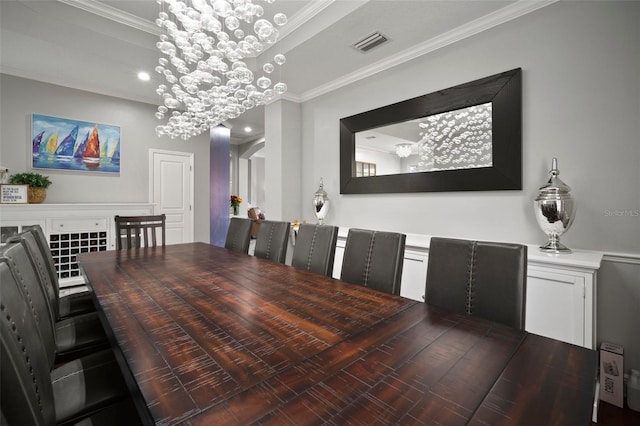 dining area featuring visible vents, arched walkways, a notable chandelier, and ornamental molding