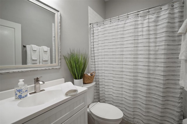 bathroom with toilet and vanity