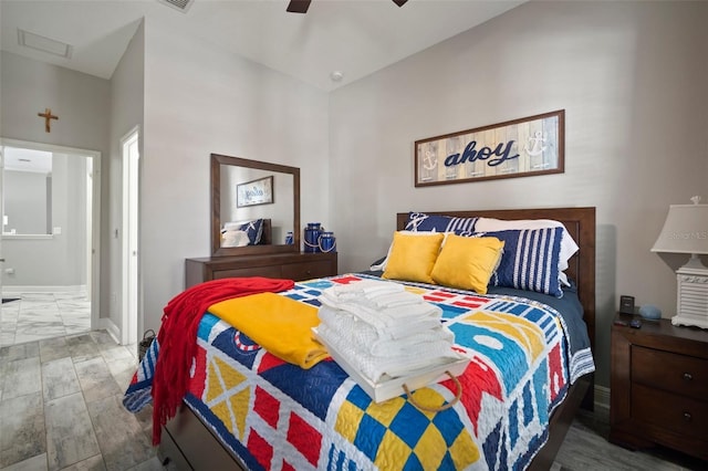 bedroom featuring a ceiling fan and baseboards