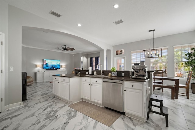 kitchen with stainless steel dishwasher, visible vents, marble finish floor, and a sink