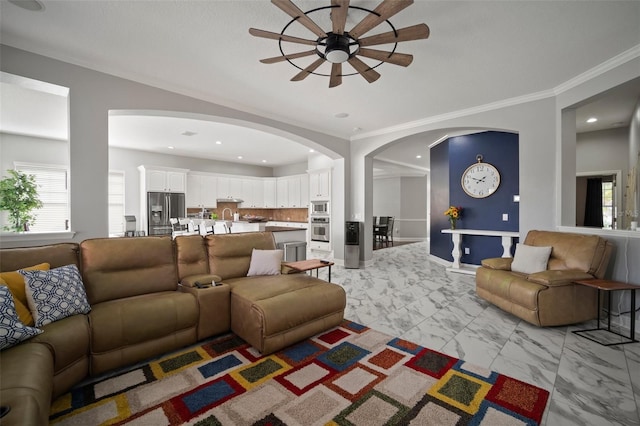 living area with recessed lighting, baseboards, marble finish floor, and ornamental molding