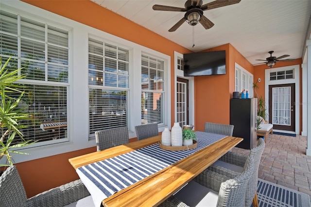 view of patio / terrace featuring outdoor dining space and a ceiling fan