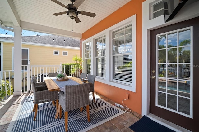 view of patio with outdoor dining area and ceiling fan