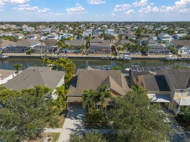 birds eye view of property featuring a residential view and a water view