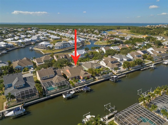 bird's eye view with a residential view and a water view