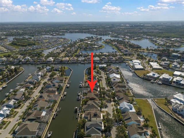 drone / aerial view featuring a residential view and a water view