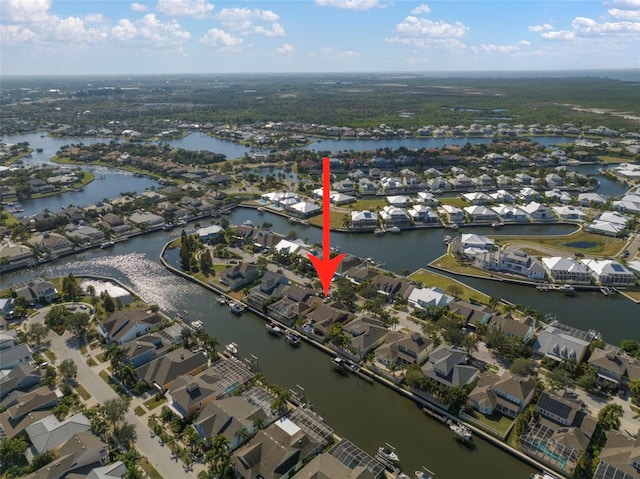 aerial view with a water view and a residential view