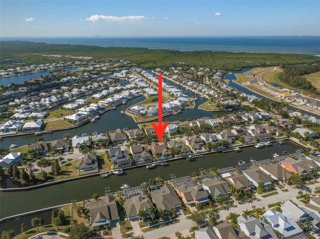 birds eye view of property with a residential view and a water view