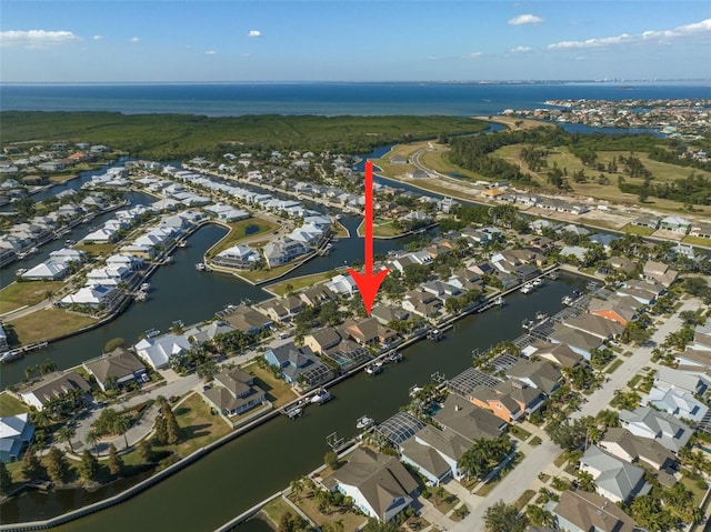 drone / aerial view featuring a residential view and a water view