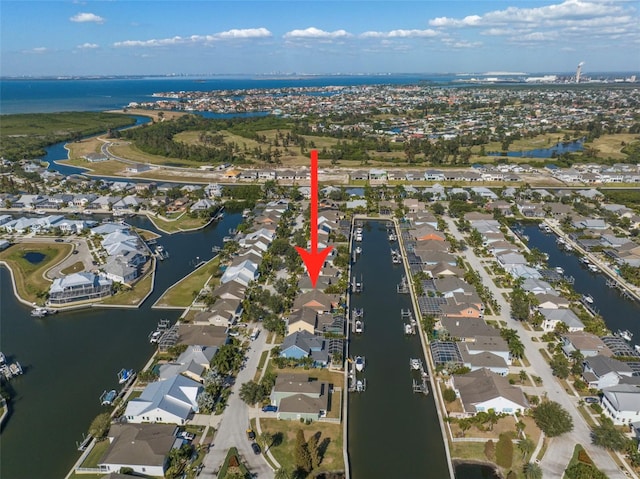 birds eye view of property featuring a residential view and a water view