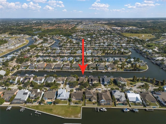 birds eye view of property with a residential view and a water view