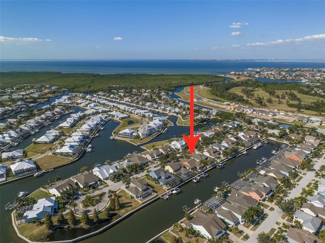 birds eye view of property featuring a residential view and a water view