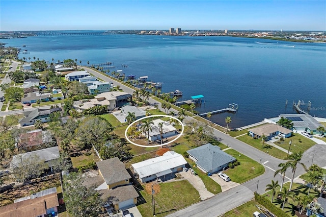 bird's eye view featuring a water view and a residential view