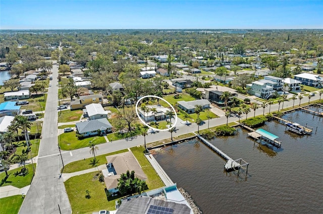 bird's eye view featuring a water view and a residential view