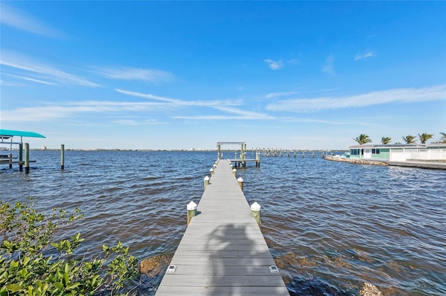 view of dock with a water view and boat lift