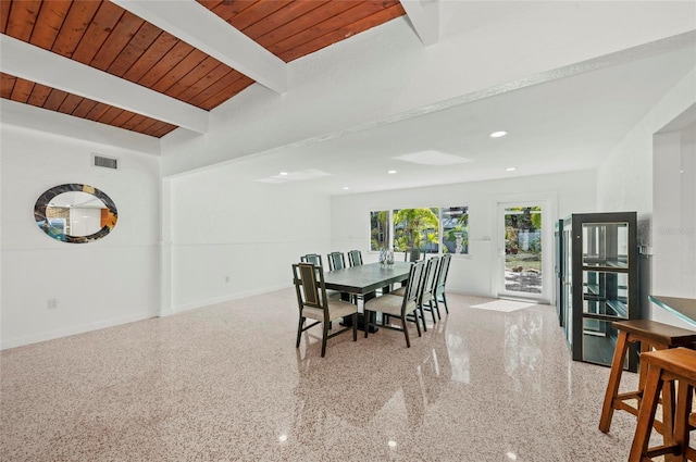 dining space with light speckled floor, wooden ceiling, visible vents, baseboards, and beamed ceiling