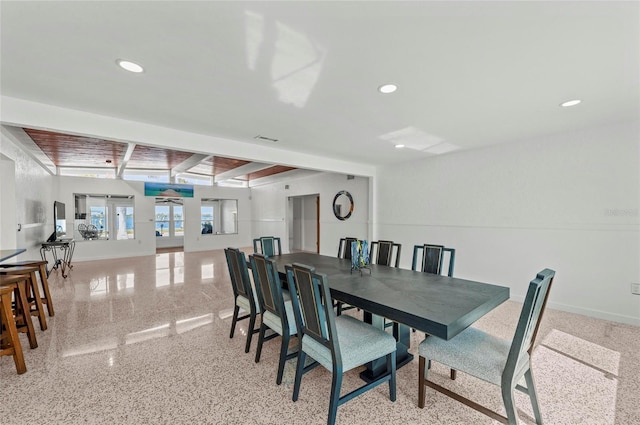 dining area featuring recessed lighting, beamed ceiling, and baseboards