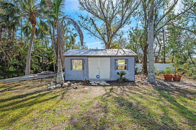 view of shed with fence