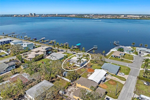 aerial view featuring a residential view and a water view