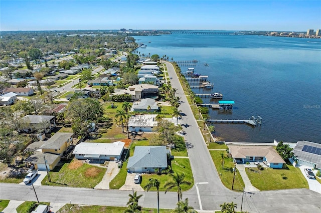 birds eye view of property featuring a water view and a residential view