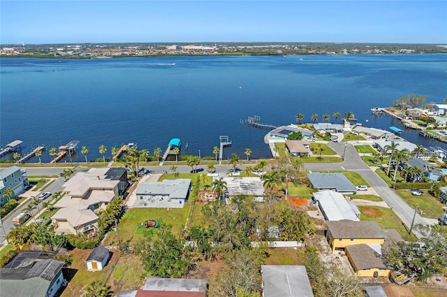 drone / aerial view featuring a residential view and a water view