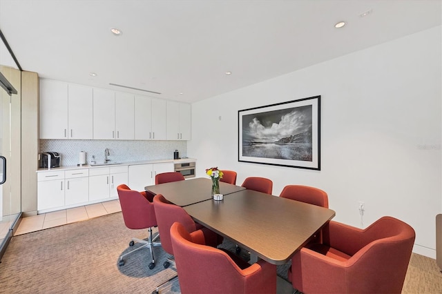 dining space featuring light tile patterned floors and recessed lighting