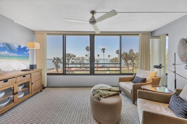 interior space featuring carpet floors, plenty of natural light, and a ceiling fan