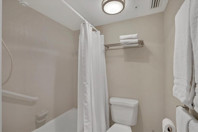 full bathroom with visible vents, toilet, and shower / bath combo with shower curtain