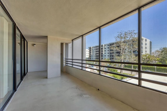 unfurnished sunroom with a view of city