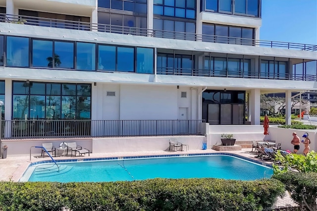 community pool featuring a patio area