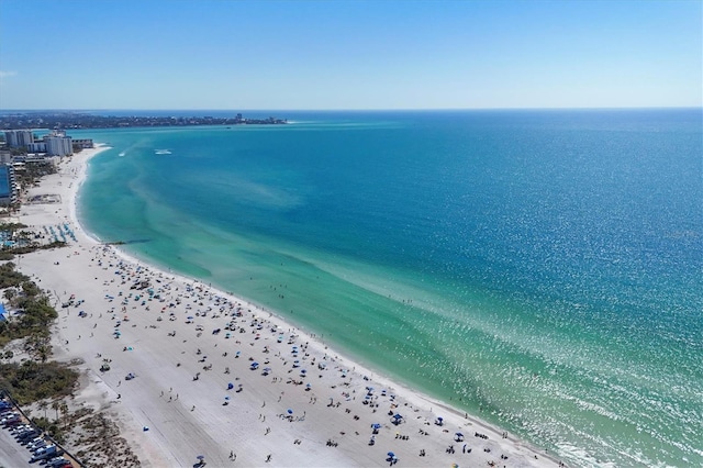 birds eye view of property featuring a water view and a view of the beach