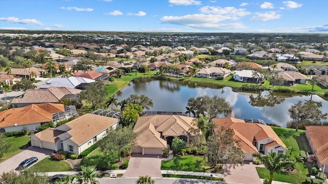 bird's eye view featuring a residential view and a water view