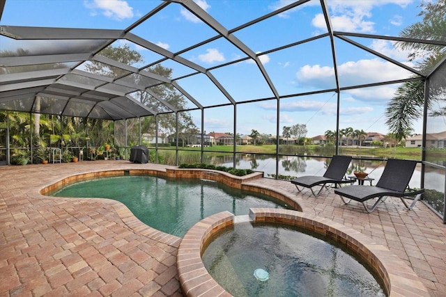 view of pool featuring glass enclosure, a water view, a grill, a pool with connected hot tub, and a patio area