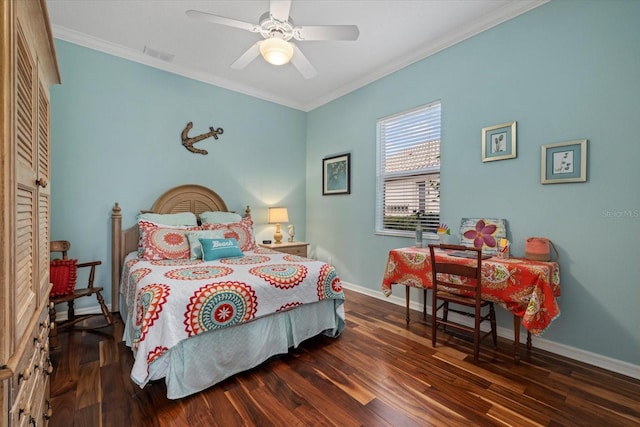 bedroom featuring baseboards, wood finished floors, visible vents, and crown molding