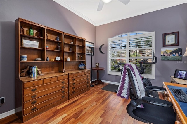 home office featuring ornamental molding, ceiling fan, light wood-style flooring, and baseboards