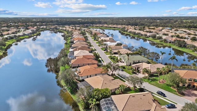 bird's eye view with a water view and a residential view