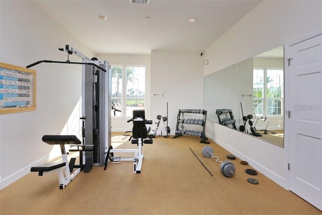 exercise room with carpet floors, recessed lighting, visible vents, and baseboards