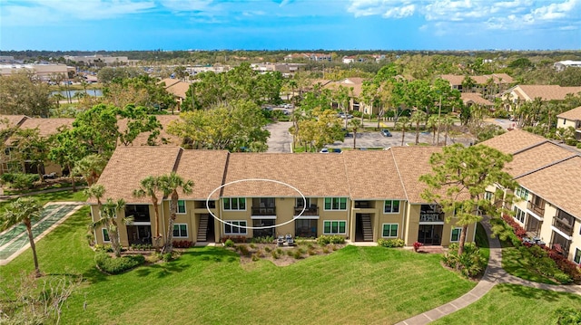 birds eye view of property with a residential view