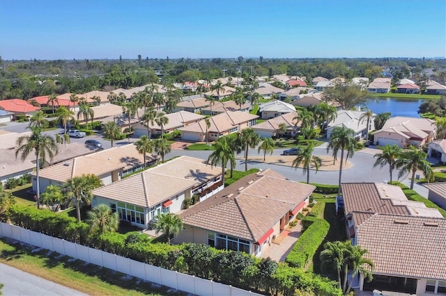 birds eye view of property featuring a residential view and a water view