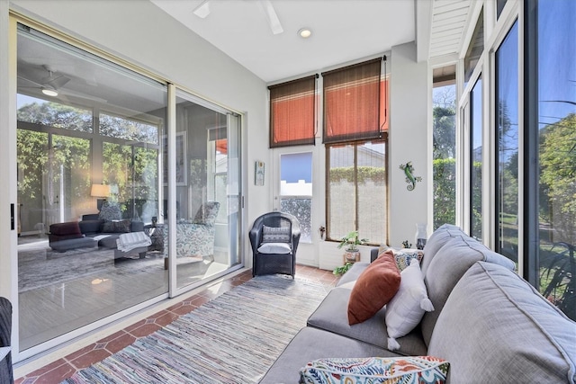 sunroom / solarium with a ceiling fan